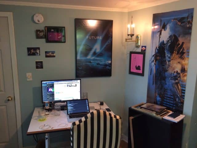 A Cornershop Creative employee's office setup. Desk, computer, striped chair.