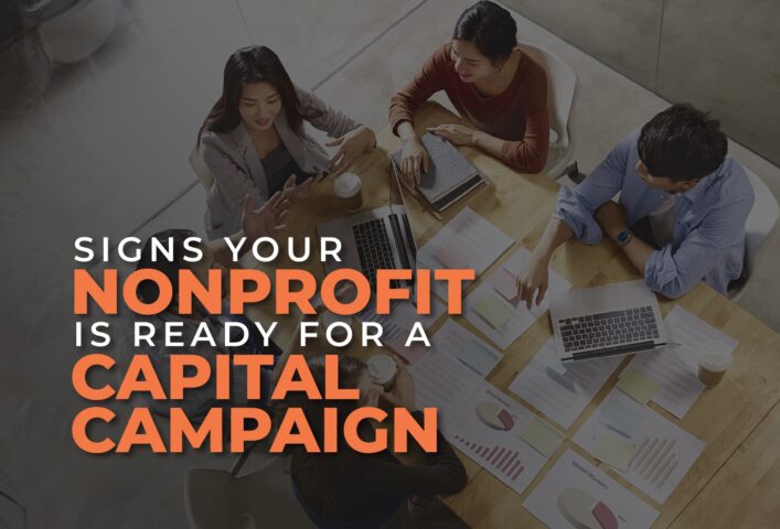The title of the article over an image of a nonprofit team working at a table.