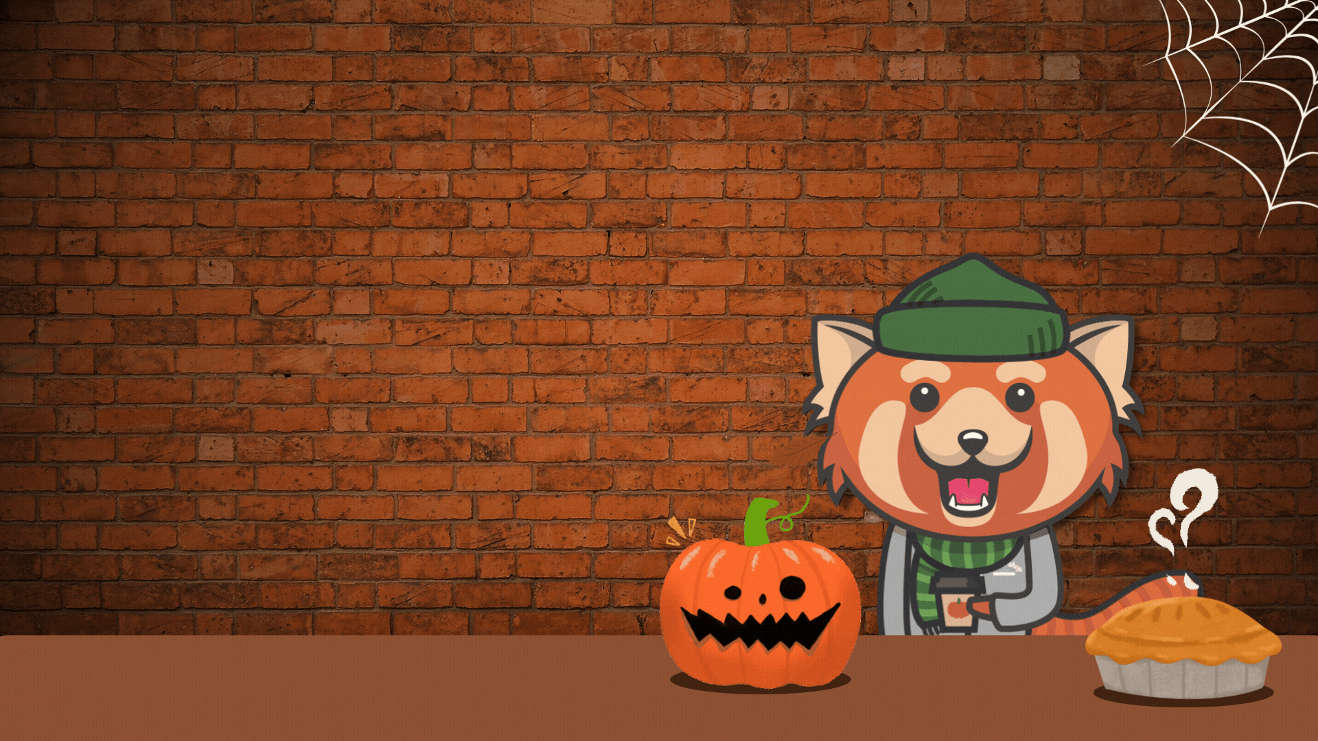 Rowdy drinking a cup of pumpkin spiced coffee surrounded by a pumpkin, pie, and spider web.