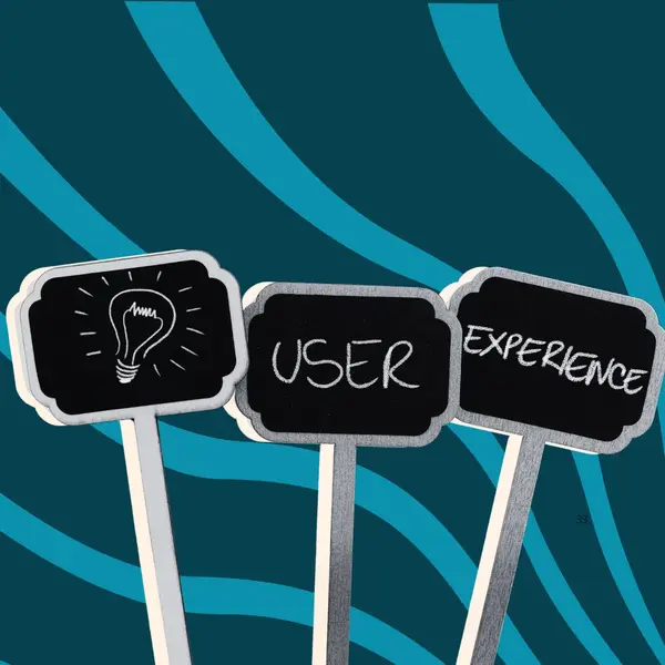 Picket signs that include images and words related to user experience.