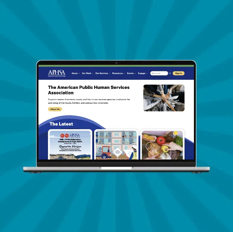A laptop displays the homepage of the American Public Human Services Association website, representing digital marketing for associations