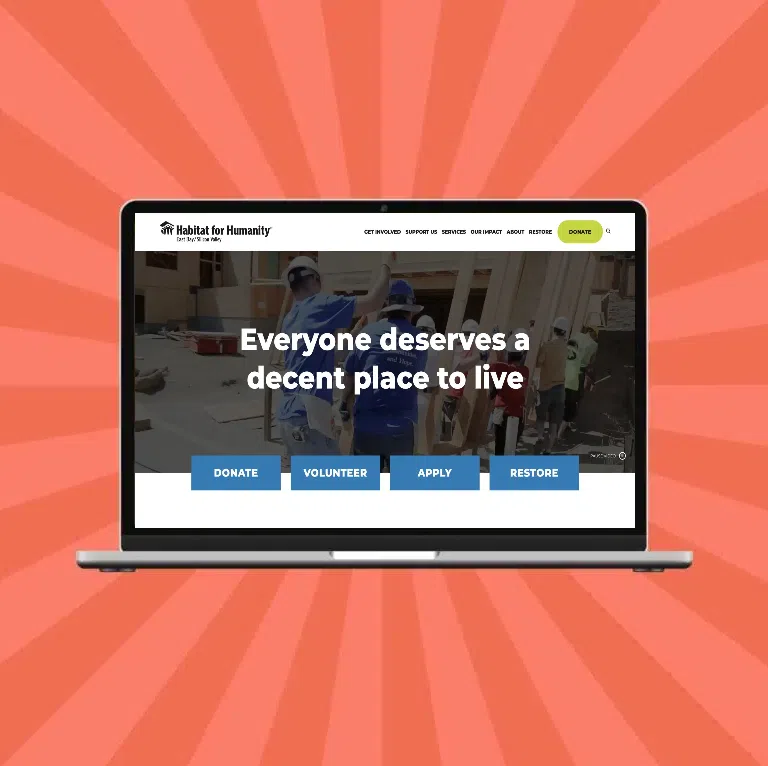 A laptop displays the website for a local Habitat for Humanity, a community development organization that trusts Cornershop Creative's digital marketing services.